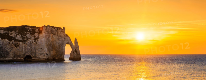 Panoramic view of Etretat Aval cliff at sunset