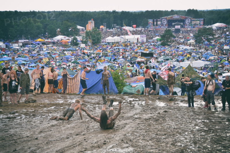KOSTRZYN NAD ODRA, POLAND - AUGUST 4: Festival Przystanek Woodstock - fans bath in the mud in front camping  on August 4, 2012 in Kostrzyn Nad Odra, P