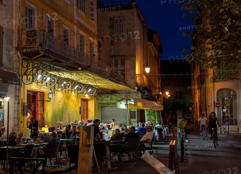 Café Van Gogh in Arles, Provence-Alpes-Cote d'Azur, France - September 15, 2010: Warm summer evening in café at the Place du Forum