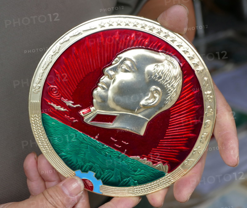 Mao Zedong plaque on sale in Beijing, China, 2019. Mao Zedong was the Chairman of the Communist Party of China from 1945 until his death in 1976.