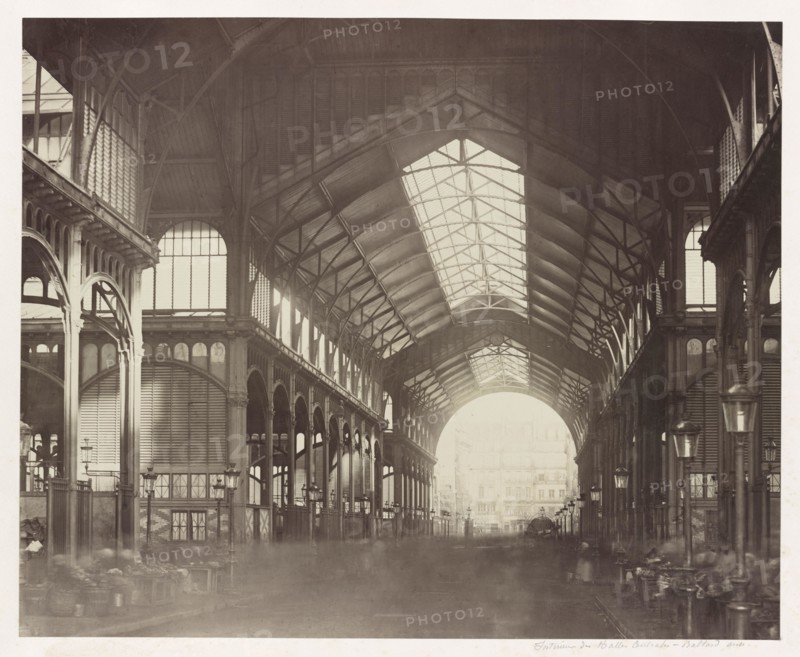 Vintage photo circa 1867 showing inside Les Halles, the central fresh food market of Paris. In the 1850s, Victor Baltard designed the cast iron and glass building which was demolished in 1971