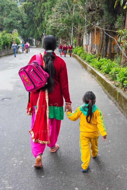 Parent taking kid to school, Gangtok, Sikkim, India