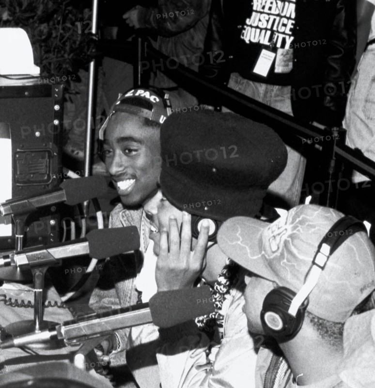 **FILE PHOTO** Man Arrested In Connection with the 1996 Murder Of Tupac Shakur** The Digital Underground (with Tupac Shakur) doing an interview at the KMEL Summer Jam at the Shorline Ampitheatre in Mountain View, CA. August, 1991. Credit: Pat Johnson/MediaPunch