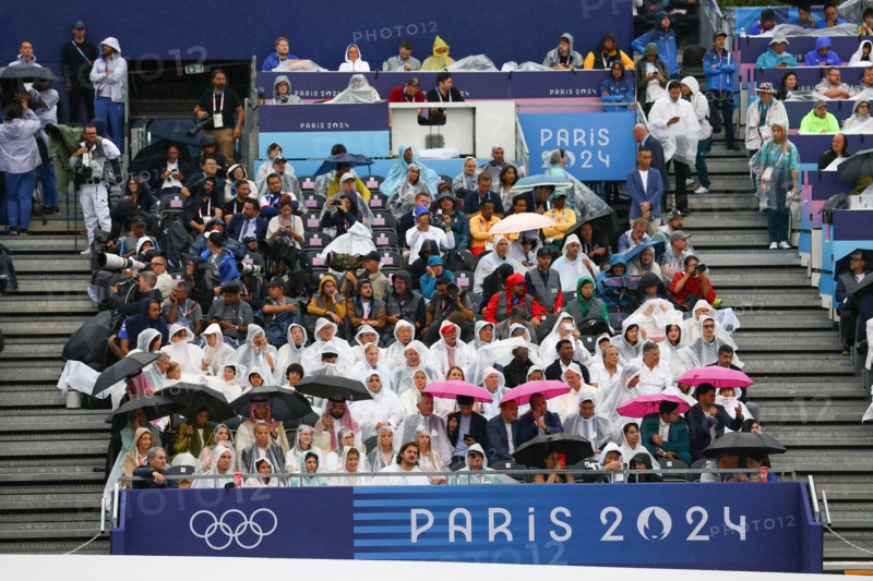 July 26th, 2024 - Paris, France: Spectators under pouring rain during the Opening Ceremony of the Paris 2024 Olympics (photo by Mickael Chavet)