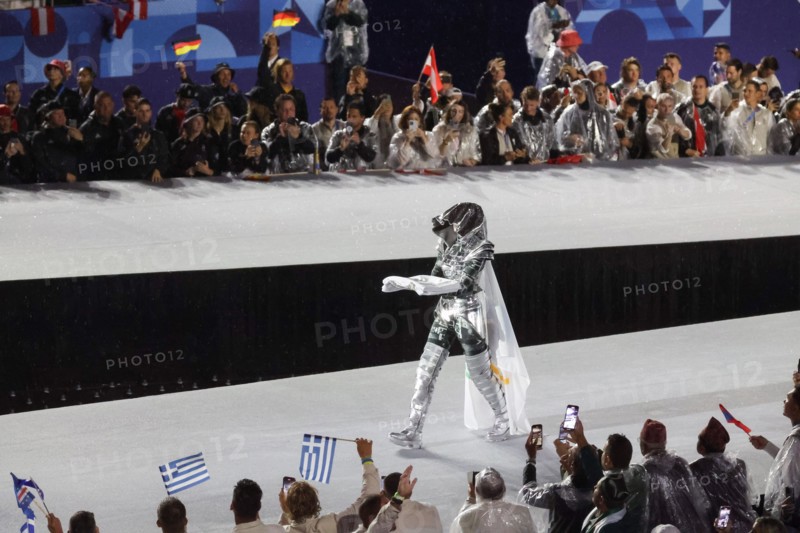 July 26th, 2024 - Paris, France: the Horsewoman wearing a silver and black armour (Floriane Issert) presents the Olympic Flag at Place du Trocadero du