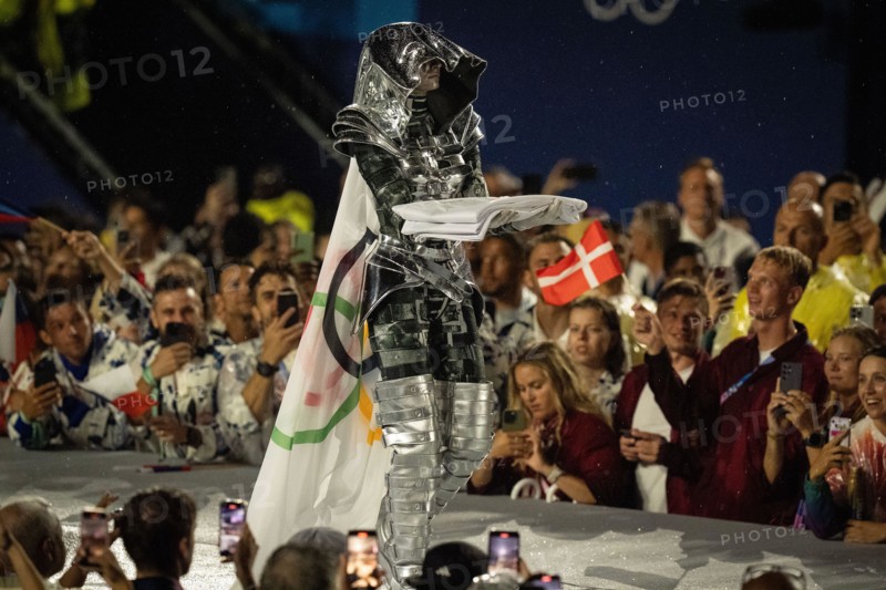 The Olympic flag is carried during the opening ceremony of the 2024 Olympic Games on Friday, July 26, 2024,in Paris, France.