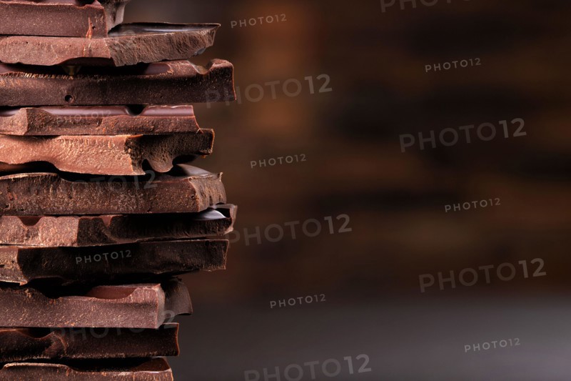 chocolate tower of dark chocolate bars, dessert food