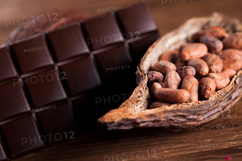Cocoa pod and cocoa beans on the wooden table