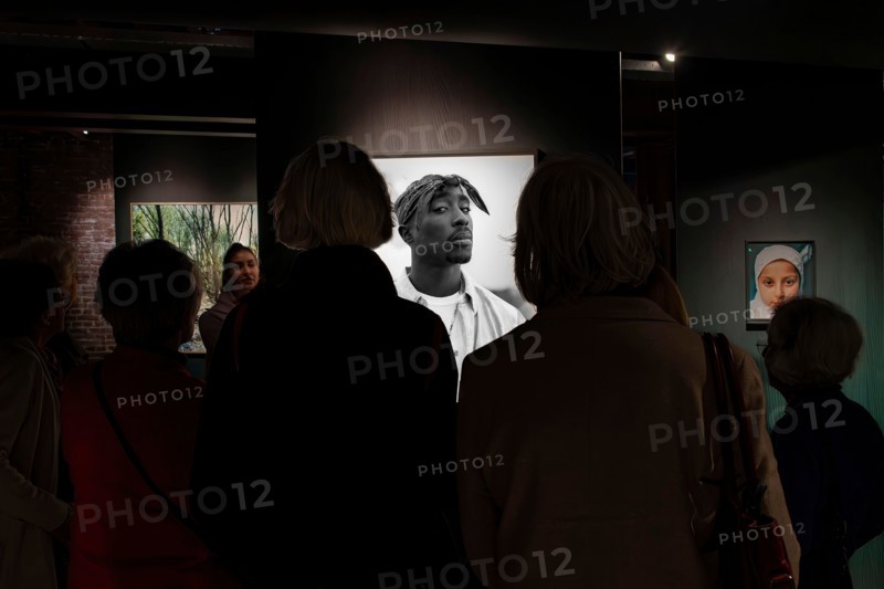 Rotterdam, the Netherlands-February 10, 2026; Visitors and guide at rapper Tupac Shakur photo by Dana Lixenberg in new Dutch National Museum of Photog