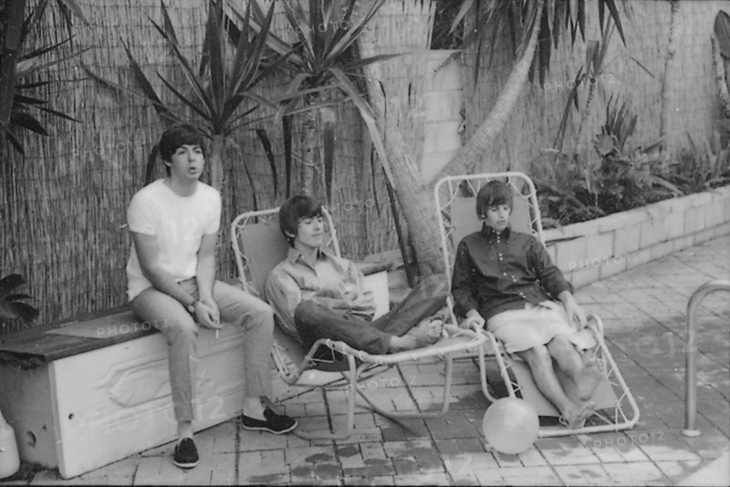 Beatles files 1964 The Beatles relaxing in sun loungers by their swimming pool in Bel Air in California during their first American tour August 1964
