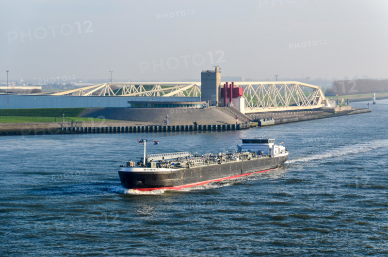 A chemical barge passing the Maeslantkering on the Nieuwe Waterweg, Rotterdam, a storm surge barrier