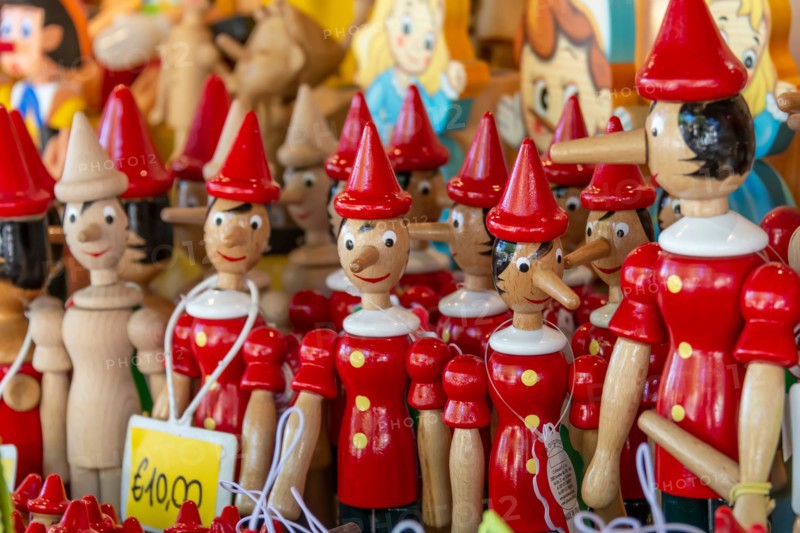 Wooden figurines depicting the character of Pinocchio in Collodi, Italy