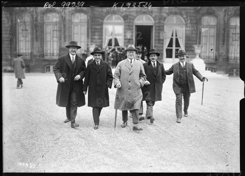 A press photograph from 1925 records Texier, Compère-Morel, Paul Faure, Léon Blum and Roger Salengro as members of a socialist delegation visiting Paul Painlevé in Paris. The collective portrait documents political consultation during a period of French political crisis.