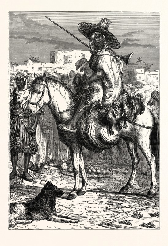 AN ARAB MERCHANT AT TLEMCEN, ALGERIA