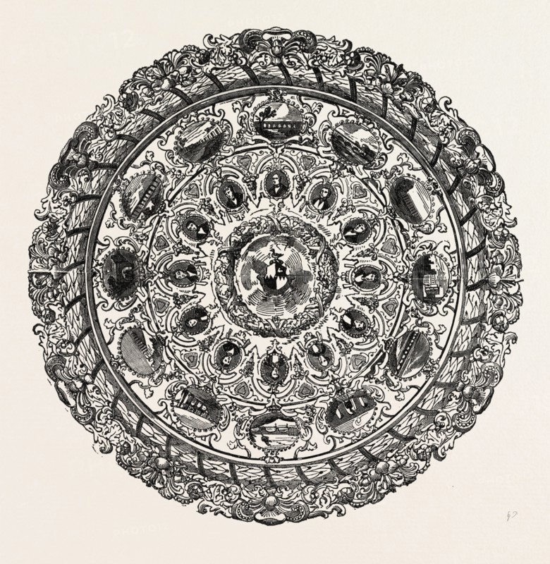 THE BRASSEY TESTIMONIAL; The centre of the shield, surrounded with an elaborate wreath of oak leaves, contains the inscription, and the arms of Brassey, as derived from an uninterrupted line of ancestry dating from the Brasseys, of Bulkeley, in county Chester, 1340. The next portion of the circle, which is concave in form, is divided into twelve arch-headed niches, richly sculptured, from the keystone of which are suspended medallions containing miniatures of the engineers under whom Mr. Brassey has executed railway works. Above these arches, on the flat margin of the shield, and immediately over the portraits, are twelve other oval tablets, each one being a miniature picture of some great work of the respective engineers before mentioned. Beyond these views, and forming the outer edge of the shield, is a beautiful chaplet of laurel leaves, divided by thirty-six bands, or ribbons, each bearing the name of one of Mr. Brassey's agents, enamelled on gold, 1851 engraving