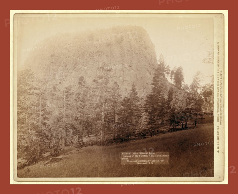 Little Missouri Butte. Largest of the 3 buttes, 4 miles from Devil's Tower, John C. H. Grabill was an american photographer. In 1886 he opened his first photographic studio