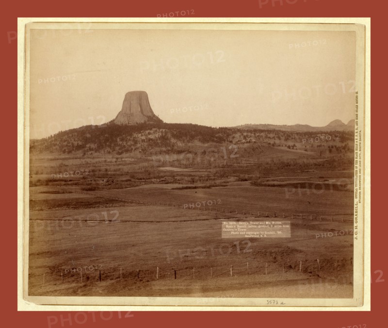 Devil's Tower and Mo. Buttes. Ryan's Ranch in foreground, 2 miles from Camera to Tower, John C. H. Grabill was an american photographer. In 1886 he opened his first photographic studio