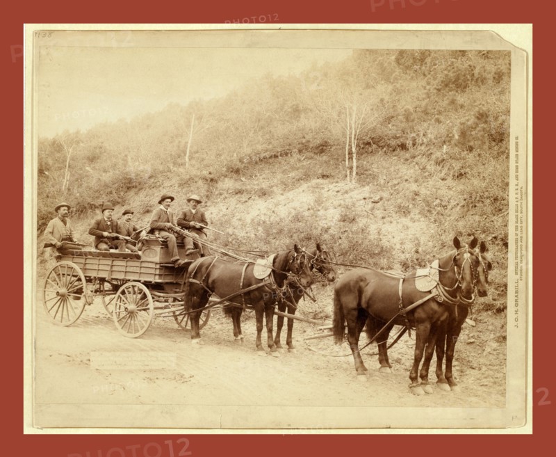 Wells Fargo Express Co. Deadwood Treasure Wagon and Guards with $250,000 gold bullion from the Great Homestake Mine, Deadwood, S.D., 1890, John C. H. Grabill was an american photographer. In 1886 he opened his first photographic studio