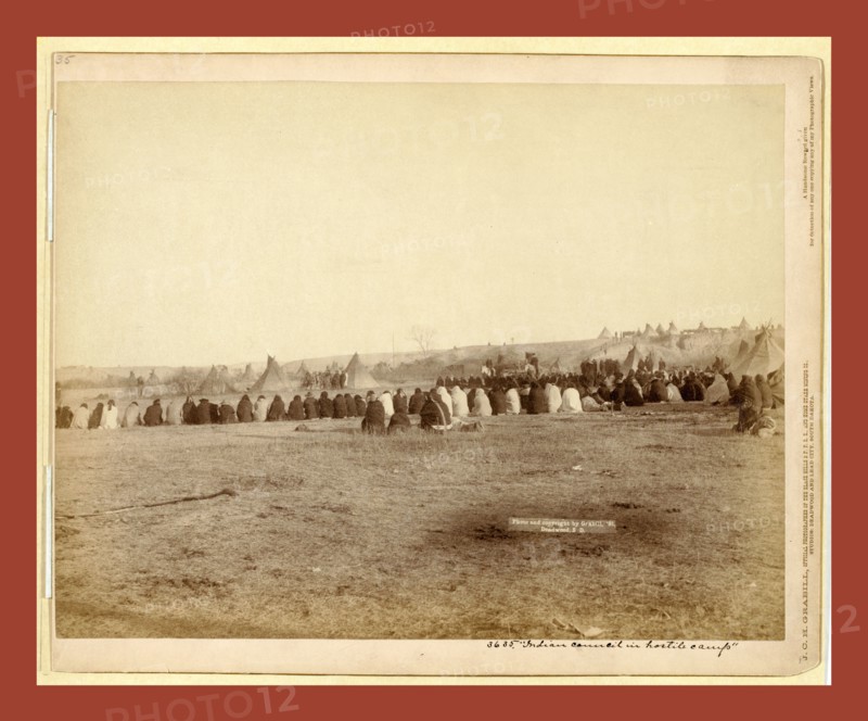Indian Council in Hostile Camp, John C. H. Grabill was an american photographer. In 1886 he opened his first photographic studio