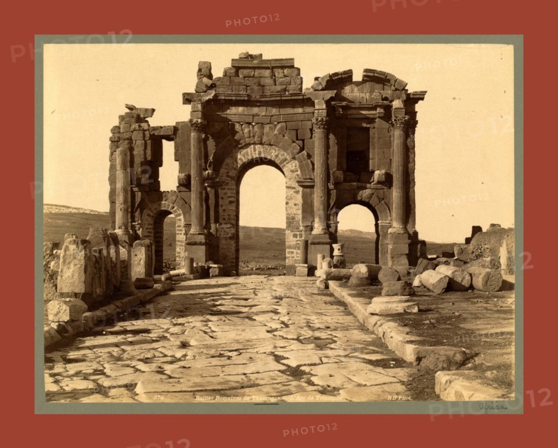 Roman ruins Thamugas, Arc de Triomphe, Algiers, Neurdein brothers 1860 1890, the Neurdein photographs of Algeria including Byzantine and Roman ruins in Tébessa and Thamugadi; mosques, shrines, public buildings, palaces, and street scenes in Mostaganem, Biskra, Algiers, Tlemcen, Constantine, Oran, and Sidi Bel AbbÃ¨s; and the cathedral at Carthage. Portraits of Algerian people include Berbers, Ouled NaÃ¯l women, and prisoners in Annaba. Tunisian views include mosques, buildings, and street scenes in Tunis.