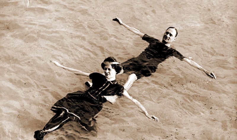 Man and woman floating on their backs in water, Couples, Swimming, 1900
