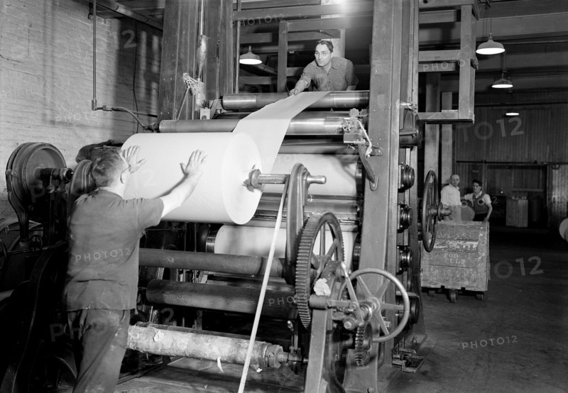 Mt. Holyoke, Massachusetts - Paper. American Writing Paper Co. Super-calender - putting on roll, starting operation, 1936, Lewis Hine, 1874 - 1940, was an American photographer, who used his camera as a tool for social reform. US,USA