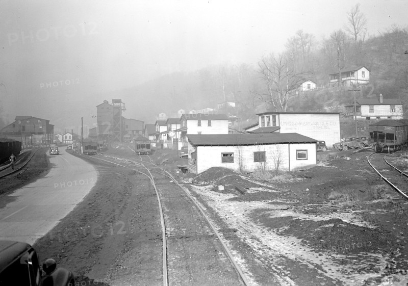Scott's Run, West Virginia. Pursglove Mines Nos. 3 and 4 - This is the largest company on Scott's Run. Scene shows main Scott's Run Highway and atmosphere loaded with coal dust and typical of Scott's Run on any working day, March 1937, Lewis Hine, 1874 - 1940, was an American photographer, who used his camera as a tool for social reform. US,USA