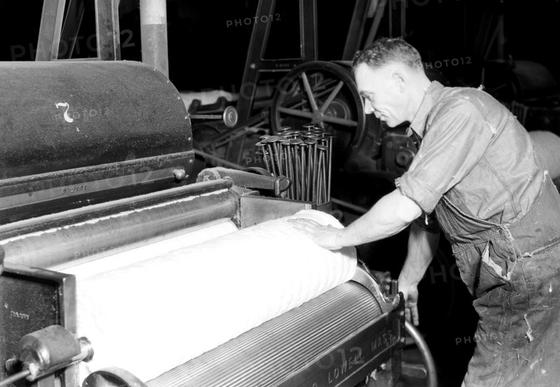 Manchester, New Hampshire - Textiles. Pacific Mills. Finisher Lapper (Front end). Makes finished laps - cotton comes from the breaker lapper, April 1937, Lewis Hine, 1874 - 1940, was an American photographer, who used his camera as a tool for social reform. US,USA