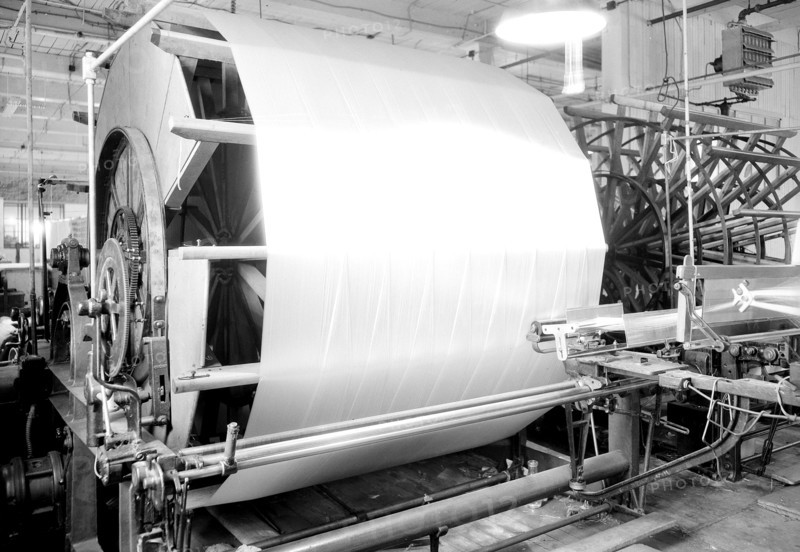 Paterson, New Jersey - Textiles. Jackson Winding and Warping Company. Picture of a Sipp-Eastwood DY type of High Speed Warper. This machine is similar to the one above except that the warp is wound on to the old type of creel. After the warp is made up it is beamed. On this type of machine it takes from 2-1/4 to 2-1/2 hours to make the usual type of warp. This estimate of time may vary slightly one way or the other, depending upon the number of sections, length of the warp, etc, June 1937, Lewis Hine, 1874 - 1940, was an American photographer, who used his camera as a tool for social reform. US,USA