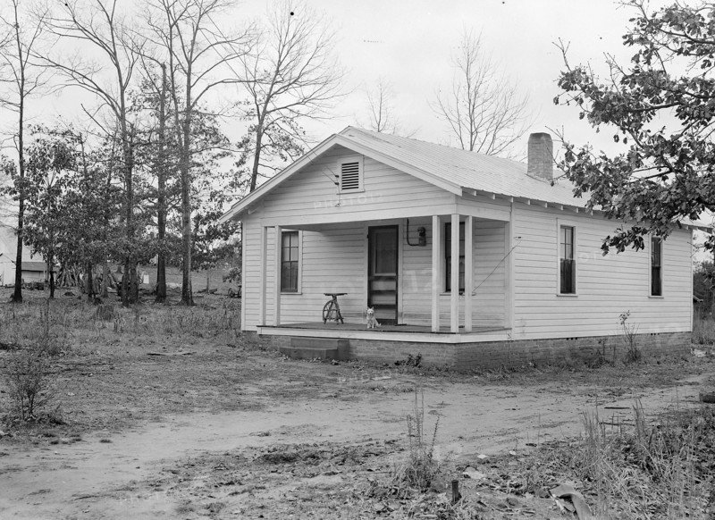High Point, North Carolina - Housing. Homes of skilled furniture workers in Tomlinson Chair Mfg. Company, High Point, North Carolina. They have bought a small parcel of land, just outside the city limits, and put up a small cottage themselves. This seems to be popular, 1936, Lewis Hine, 1874 - 1940, was an American photographer, who used his camera as a tool for social reform. US,USA