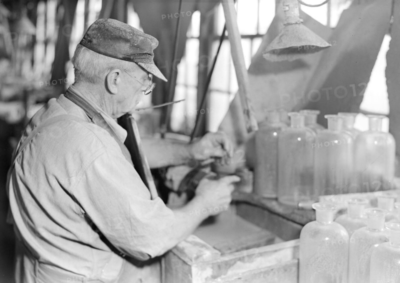 Millville, New Jersey - Glass bottles. Stopper-grinder at T. C. Wheaton Co, March 1937, Lewis Hine, 1874 - 1940, was an American photographer, who used his camera as a tool for social reform. US,USA