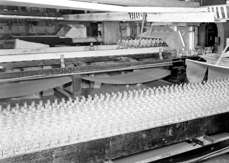 Millville, New Jersey - Glass bottles. [Numerous bottles in foreground and bottles on a conveyor belt.], 1936, Lewis Hine, 1874 - 1940, was an American photographer, who used his camera as a tool for social reform. US,USA