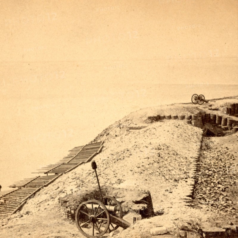 View of Fort Sumpter (i.e. Sumter). On the parapet, overlooking the harbor. Fort Sumter is a Third System masonry sea fort located in Charleston Harbor, South Carolina. The fort is best known as the site upon which the shots that started the American Civil War were fired, at the Battle of Fort Sumter on April 12, 1861. , Vintage photography