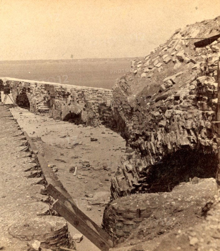 Interior of Fort Sumpter (i.e. Sumter), looking toward Charleston. Fort Sumter is a Third System masonry sea fort located in Charleston Harbor, South Carolina. The fort is best known as the site upon which the shots that started the American Civil War were fired, at the Battle of Fort Sumter on April 12, 1861. , Vintage photography