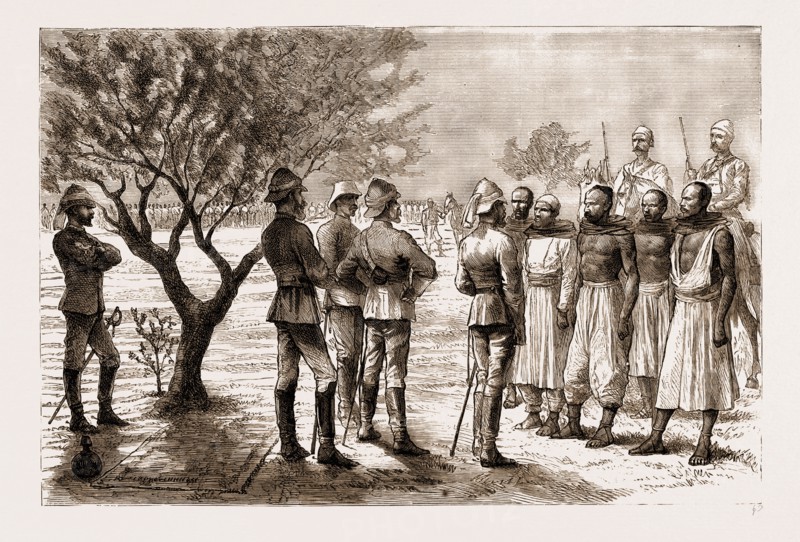 THE REBELLION IN THE SUDAN, 1883: HICKS PASHA EXAMINING ARAB TELEGRAPH WIRE-CUTTERS DURING A HALT: Baron Seckendorff, Hicks Pasha, Major Evans, Interpreter, Colonel Farquhar, Chief of Staff