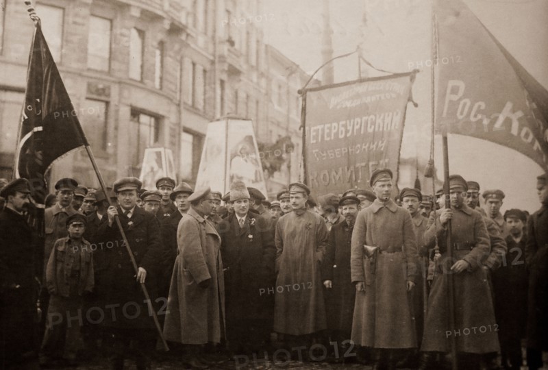 Bolshevik leaders in front of a procession for the 1st of May, 1920. In the center, one recognizes Grigori Zinoviev with an Astrakhan. The central banner reads: "Committee of the Petrograd Province". Petrograd, Saint Petersburg, Russia, History of the Russian Revolution
