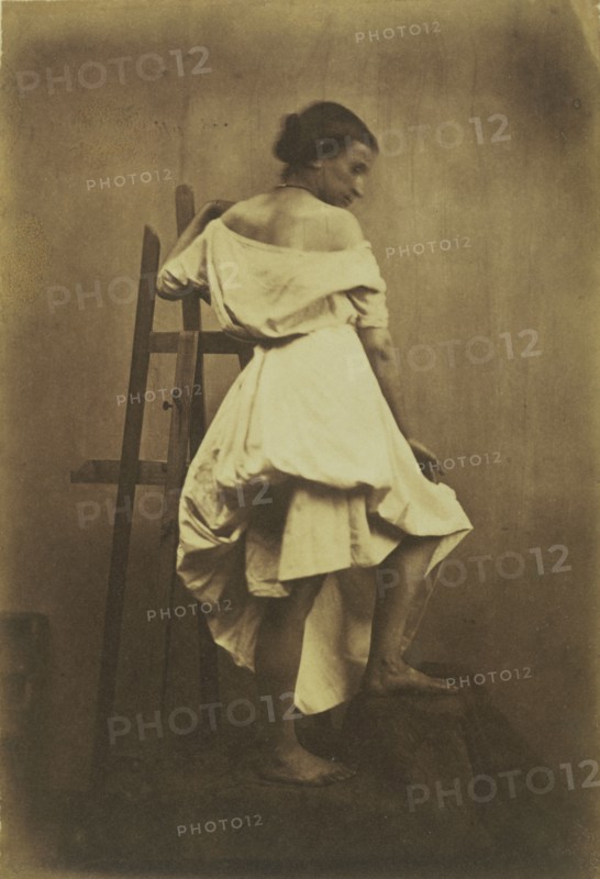 Model in White Dress with Easel