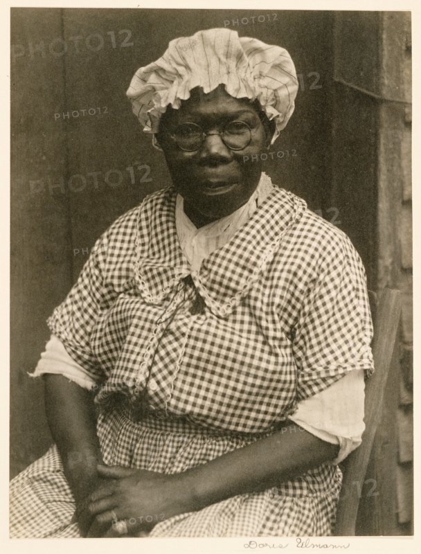 [Black Woman in Cap and Gingham Dress]