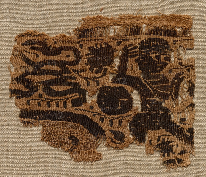 Fragment, Part of an Ornament from a Garment, 500s. Egypt, Byzantine period, 6th century. Tapestry (originally inwoven in tabby ground); linen and wool; overall: 8 x 9.9 cm (3 1/8 x 3 7/8 in.)