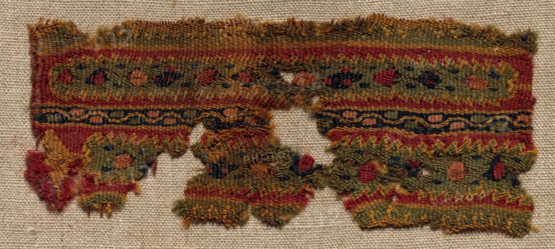 Fragment, Probably Part of an Ornament of a Tunic, 400s - 600s. Egypt, Byzantine period, 5th - 7th century. Tapestry weave: wool; overall: 5.6 x 13.1 cm (2 3/16 x 5 3/16 in.)