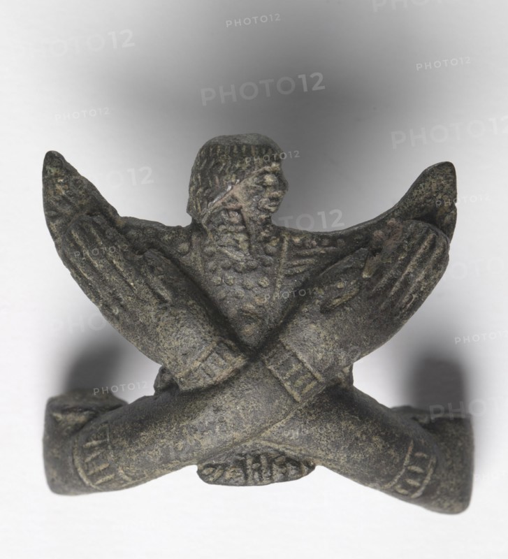 Bronze mount from a "Shawabty Bundle": Crossed Arms, c. 1336-1256 BC. Egypt, Thebes, Wadi Qubbanet el-Qirud, New Kingdom, late Dynasty 18 (1540-1296 BC) or early Dynasty 19 (1295-1186 BC). Bronze; overall: 3.5 cm (1 3/8 in.).