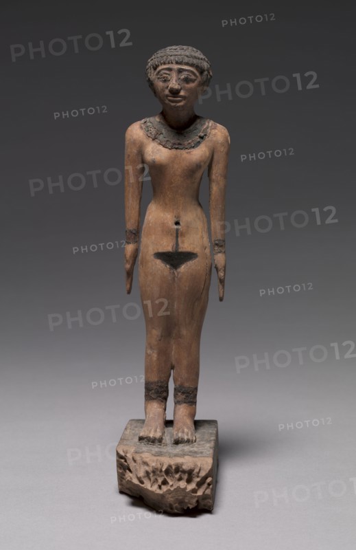 Female Statuette, c. 2040-1859 BC. Egypt, Middle Kingdom, late Dynasty 11 to Early Dynasty 12. Painted wood; with base: 28.4 x 6.8 x 12.2 cm (11 3/16 x 2 11/16 x 4 13/16 in.).