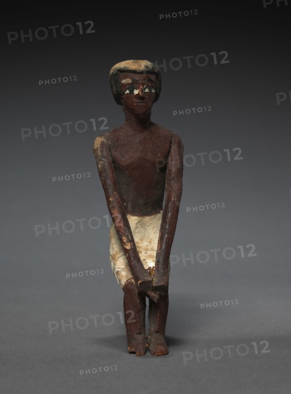 Seated Model Sailor, c. 2000-1000 BC. Egypt, Middle Kingdom, late Dynasty 11 (2040-1980 BC) to early Dynasty 12 (1980-1951 BC). Painted sycamore fig; average: 11 cm (4 5/16 in.).