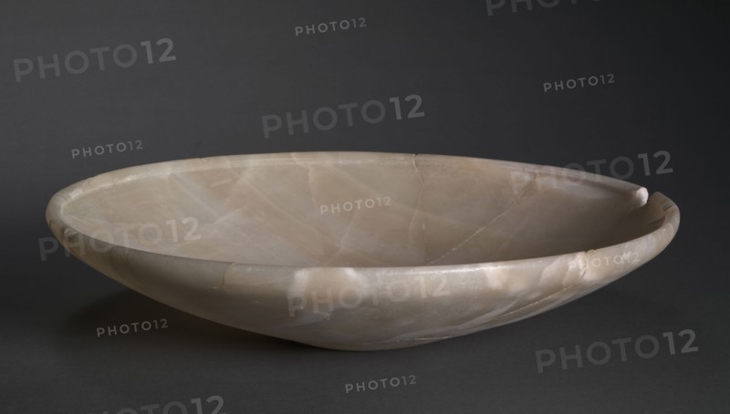 Shallow Dish, c. 2726-2647 BC. Egypt, Saqqara, Old Kingdom, Dynasty 2, reign of Nynetjer or later. Travertine; diameter: 35.9 cm (14 1/8 in.); overall: 8 cm (3 1/8 in.).