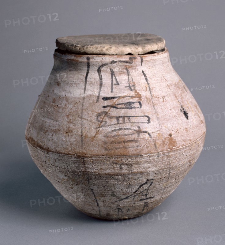 Shawabty Jar with Lid, 1295-1069 BC. Egypt, New Kingdom, Dynasty 19 (1295-1186 BC) - Dynasty 20 (1186-1069 BC). Nile silt ware; lid of limestone; diameter: 23.5 cm (9 1/4 in.); diameter of mouth: 11.3 cm (4 7/16 in.); overall: 22.9 cm (9 in.).