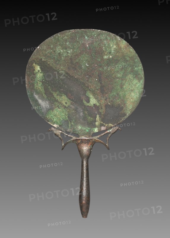 Mirror with Falcons, 1540-1296 BC. Egypt, New Kingdom, Dynasty 18. Mirror of copper, handle of tin-bronze; overall: 18.6 x 11.7 cm (7 5/16 x 4 5/8 in.).