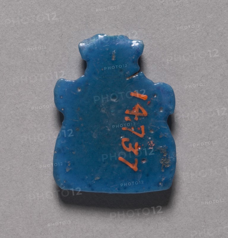 Bes Head Amulet, 1069-715 BC. Egypt, Third Intermediate Period or later. Turquoise blue faience; overall: 2.9 x 2.2 x 0.3 cm (1 1/8 x 7/8 x 1/8 in.).