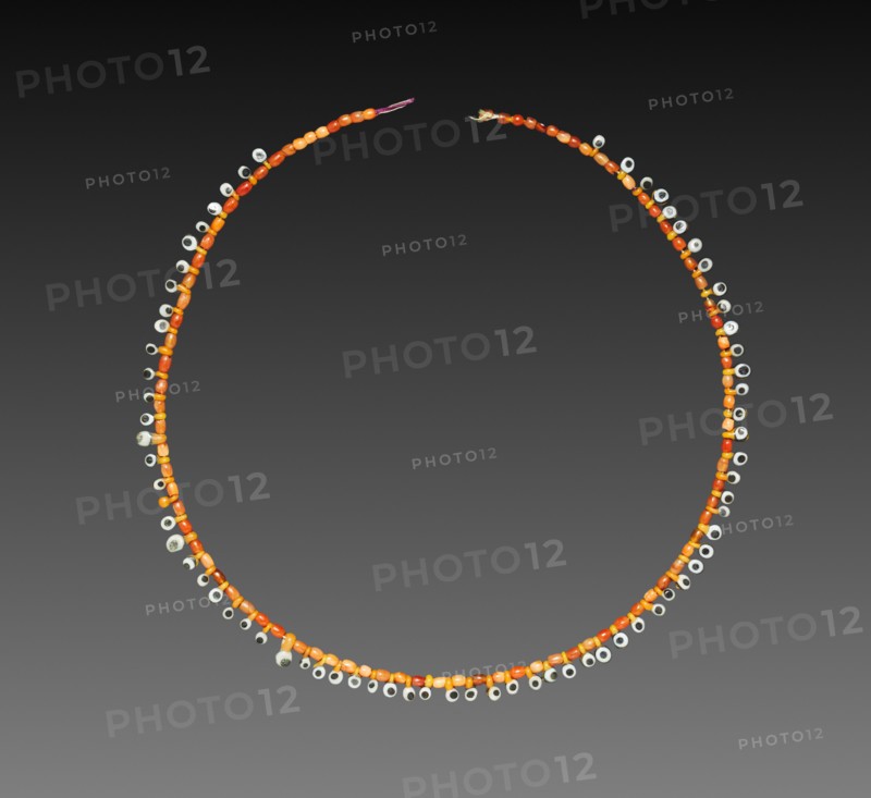 Necklace, 1980-1801 BC (barrel beads) and 1295-1186 BC (eye beads). Egypt, Middle Kingdom, Dynasty 12 (barrel beads) and New Kingdom, Dynasty 19 (eye beads). Glass and carnelian; overall: 23.8 cm (9 3/8 in.).