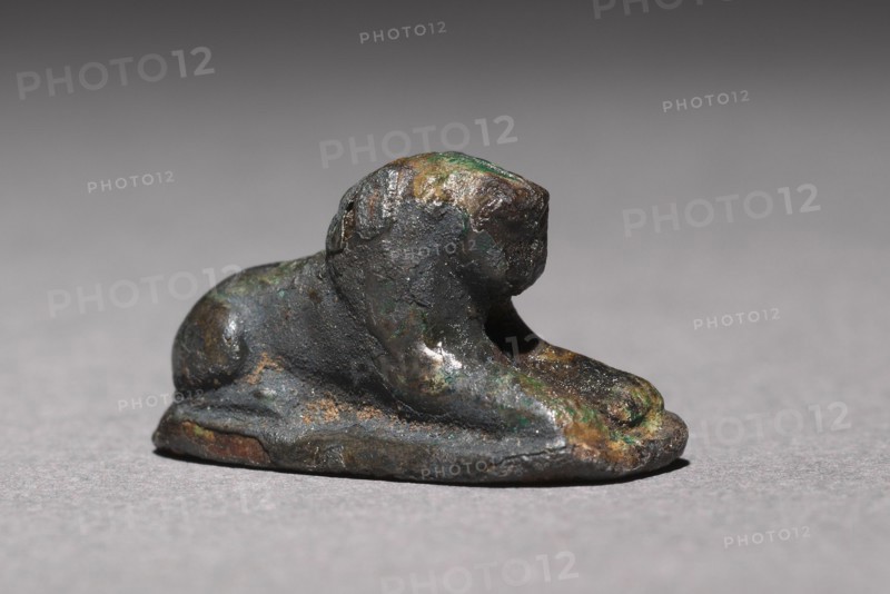 Recumbent Lion Bead, 1980-1801 BC. Egypt, Middle Kingdom, Dynasty 12. Silver foil over a clay-bulked resin core (?); overall: 1.2 x 0.7 cm (1/2 x 1/4 in.).