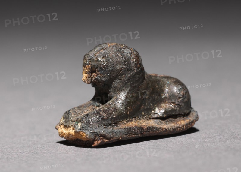 Recumbent Lion Bead, 1980-1801 BC. Egypt, Middle Kingdom, Dynasty 12. Silver foil over a clay-bulked resin core (?); overall: 1.2 x 0.7 cm (1/2 x 1/4 in.).